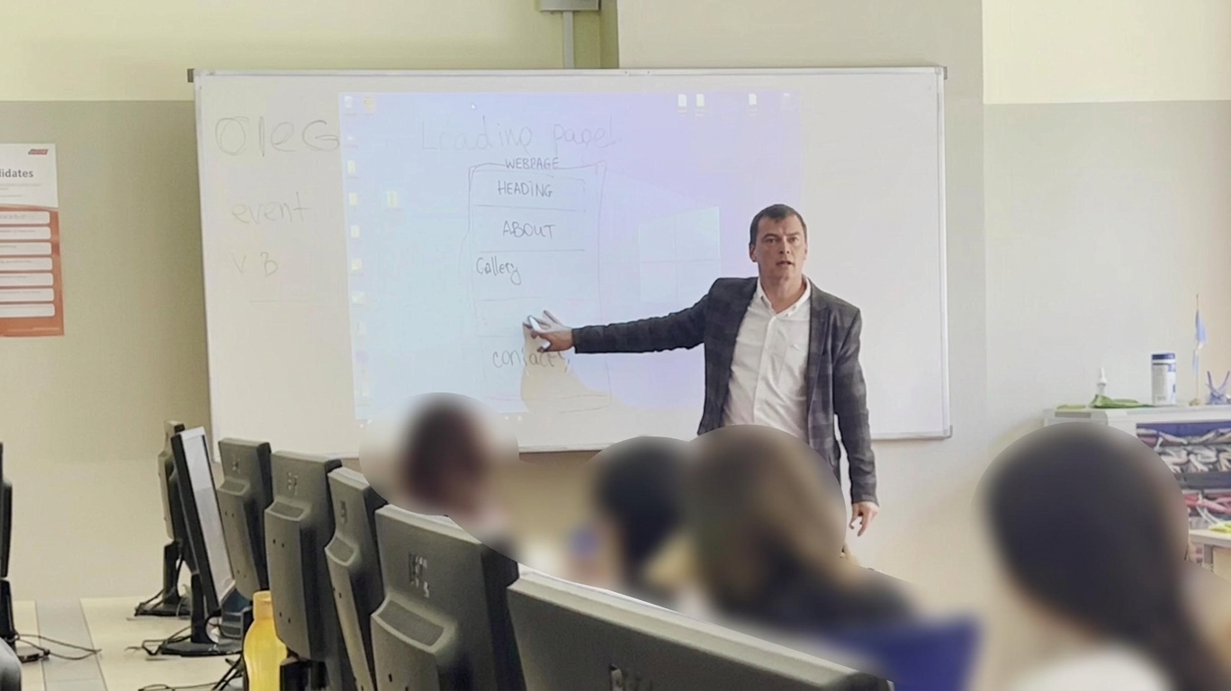 Oleg teaching kids how to design a landing page